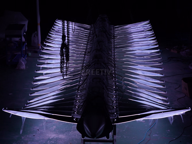 Automatic wave motion in mechanical flying fish kinetic installation