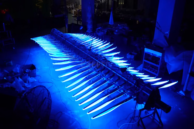 Bionic wings on mechanical flying fish with wave-flapping motion