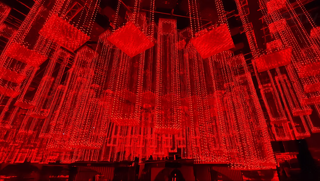 Close-up of 60% transparent Dragon 3D Display kinetic sculpture with LED pixels Milan 2024