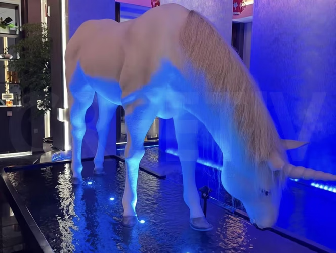 Large-scale custom bionic horse kinetic sculpture installed in luxury hotel lobby