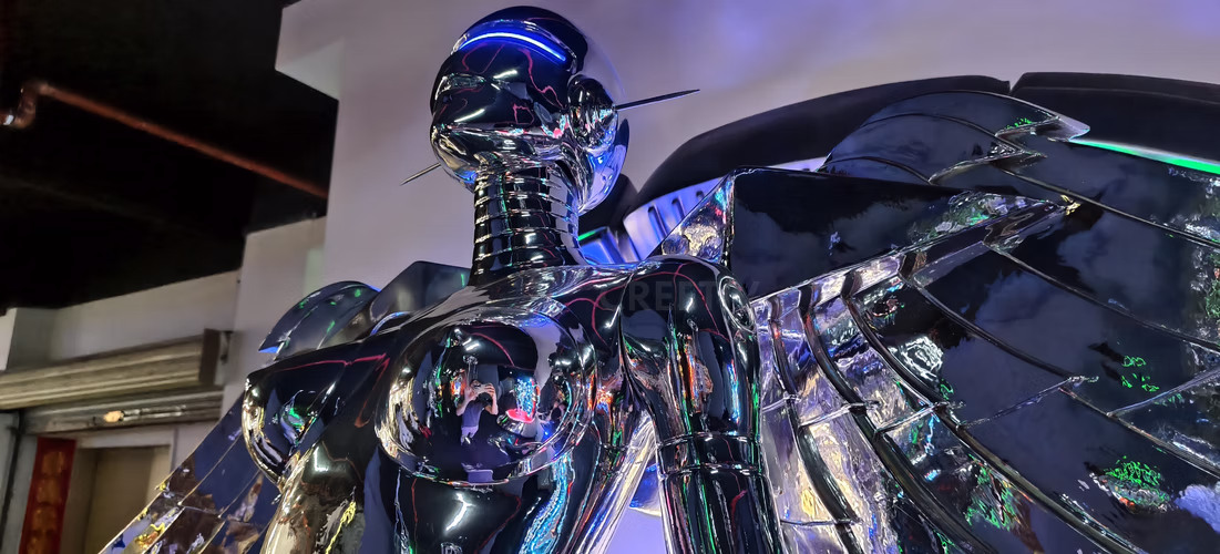 Mirror metallic luster on custom future goddess fiberglass sculpture