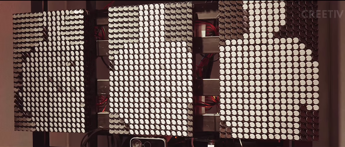 Modular Flip-Dot Kinetic Wall panels creating large-scale mechanical pixel display