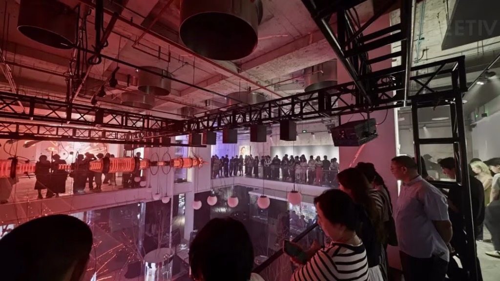 Visitors interacting with Energy Memory sound-reactive kinetic light wall Shanghai exhibition